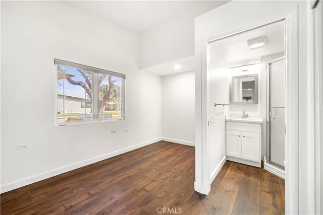 a view of a bathroom with wooden floor