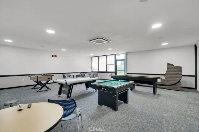 a living room with lots of furniture and a wooden floor