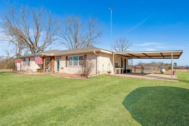 a view of a house with a big yard