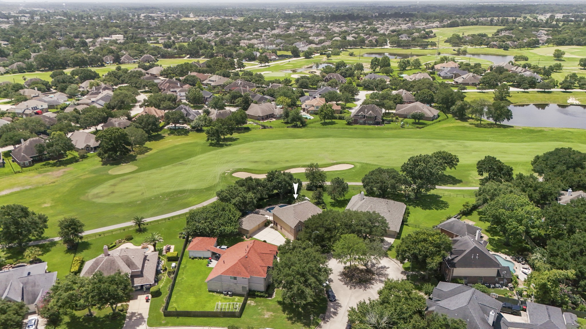 5807 Sequoia Trace Court Spring, TX 77379 - Photo 38 of 50 From above, it's easy to appreciate the home's location along the Windrose golf course, surrounded by fairways, lakes, and a canopy of mature trees.