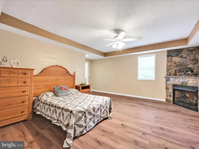 a view of room with window and wooden floor
