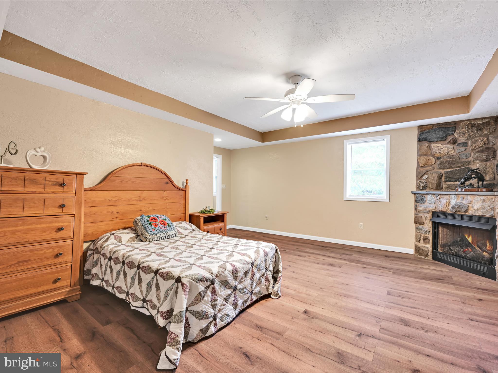 742 Power Road Manheim, PA 17545 - Photo 21 of 56 a bedroom with a bed and a fireplace