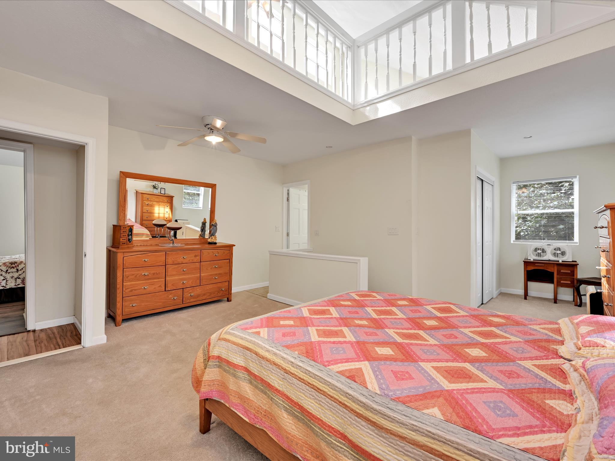 742 Power Road Manheim, PA 17545 - Photo 26 of 56 a bedroom with a large bed a chandelier and dresser