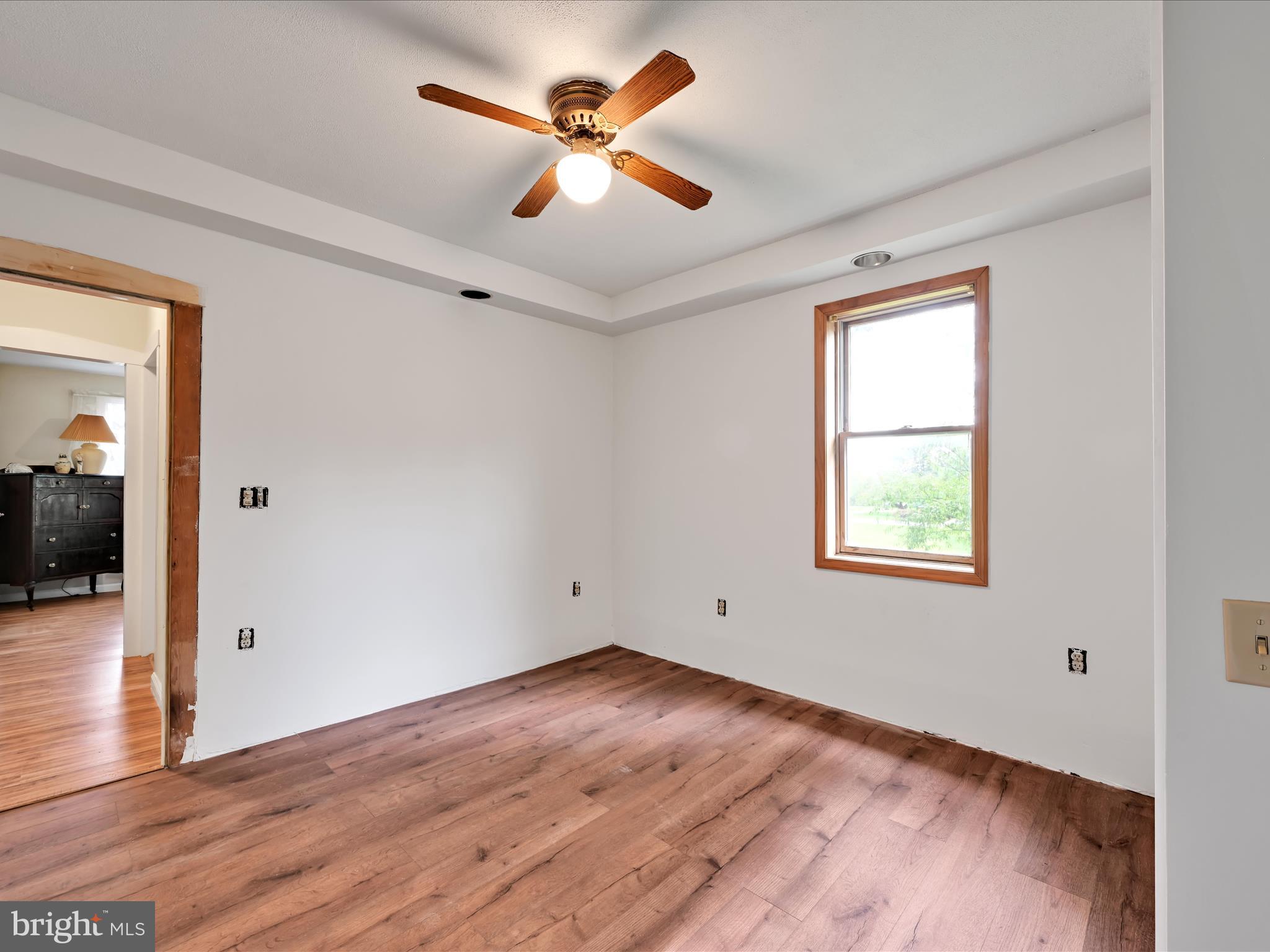 742 Power Road Manheim, PA 17545 - Photo 33 of 56 wooden floor in an empty room with a window