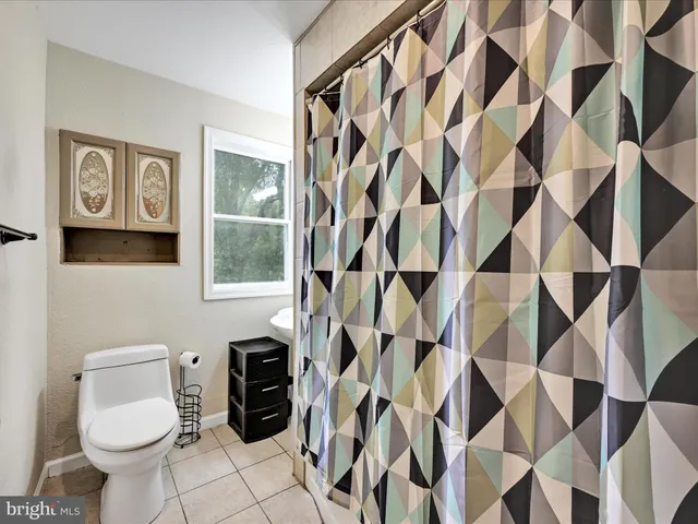 a living room with a couch and a large window