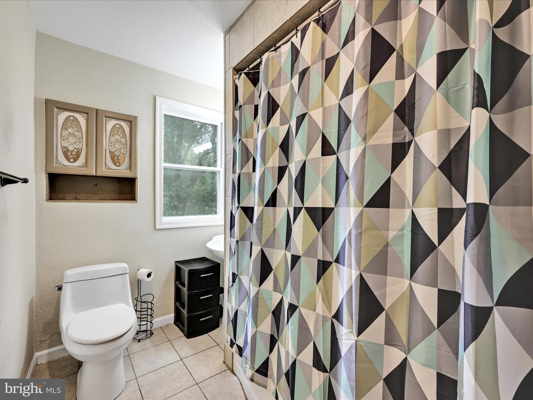 742 Power Road Manheim, PA 17545 - Photo 39 of 56 a bathroom with a toilet and a shower curtain