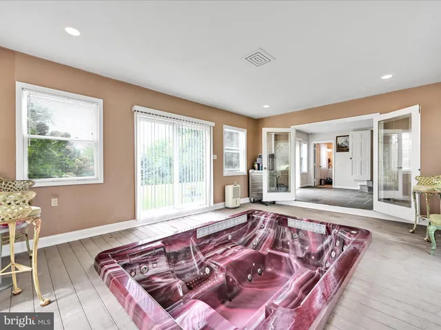 a view of a patio with table and chairs with wooden fence