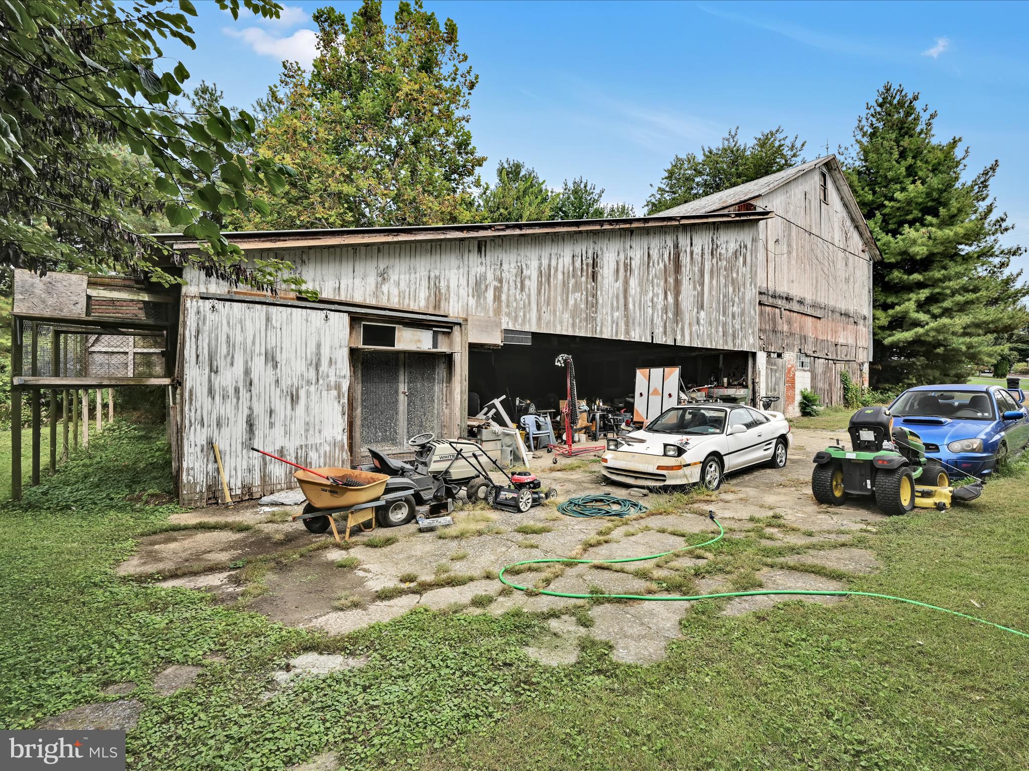 742 Power Road Manheim, PA 17545 - Photo 44 of 56 a view of a patio with table and chairs with wooden fence