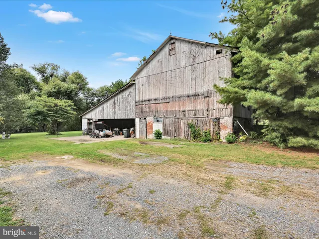 a front view of a house with plants