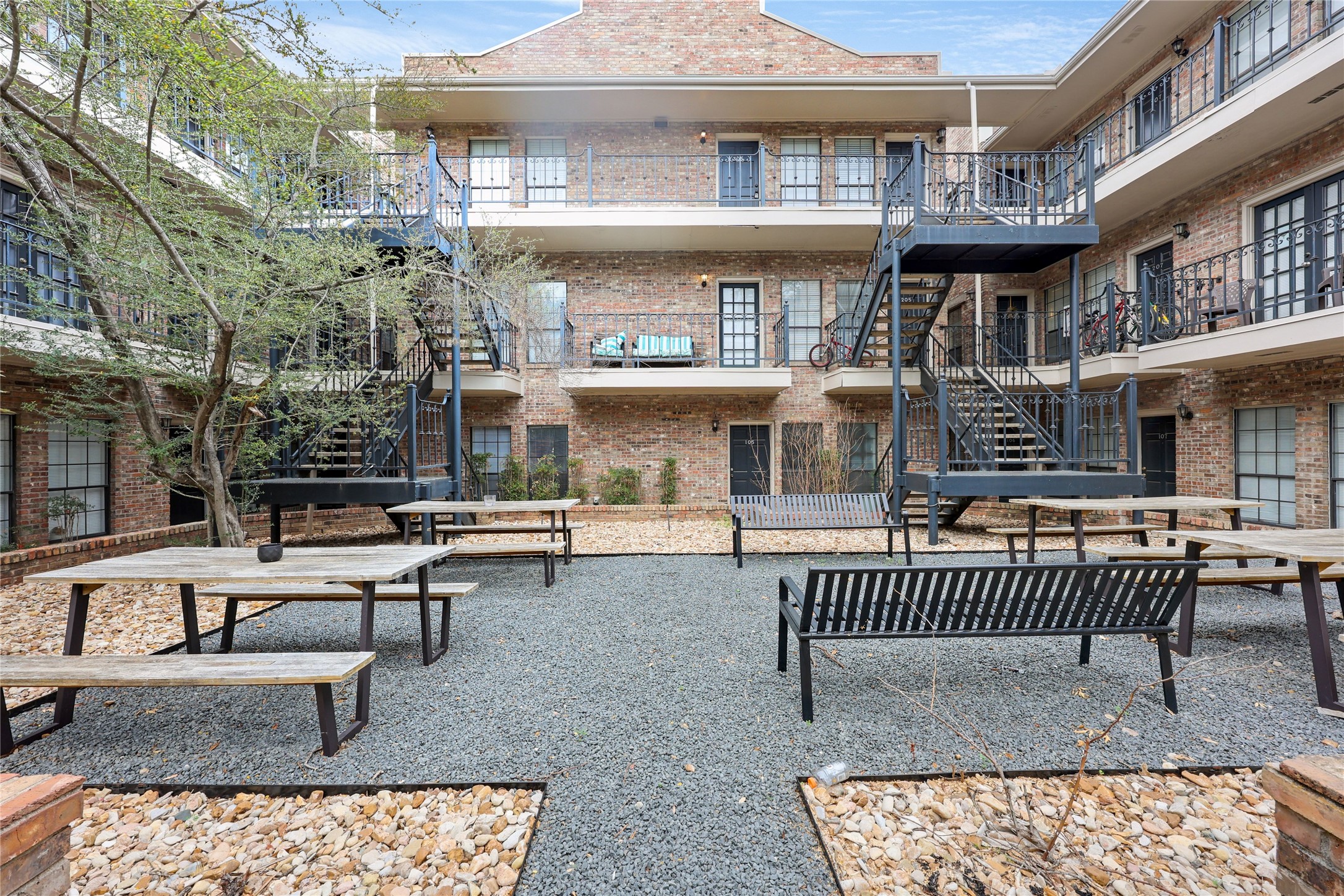 2801 Rio Grande Street, Unit 103 Austin, TX 78705 - Photo 13 of 15 a view of a house and a deck