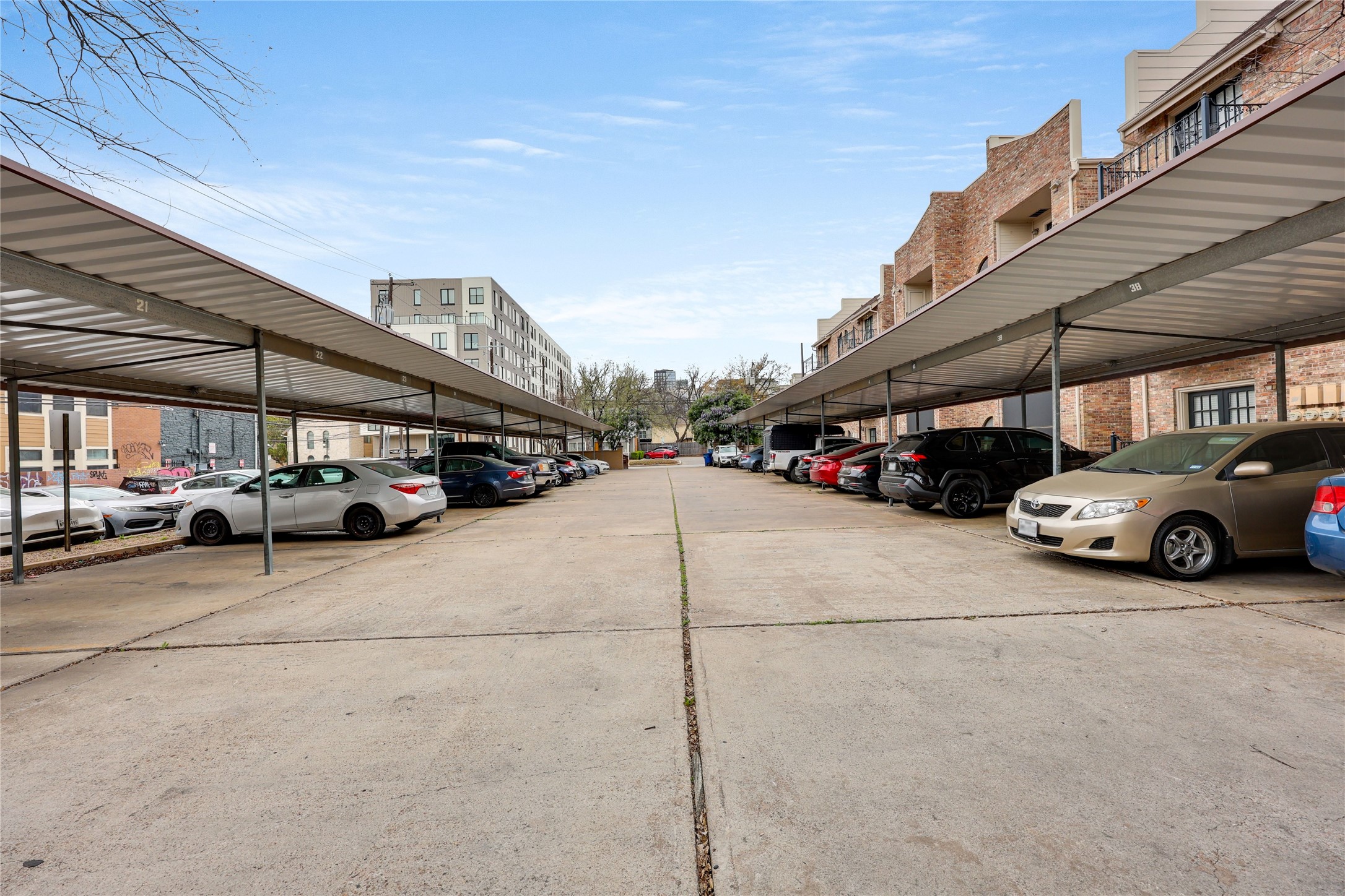 2801 Rio Grande Street, Unit 103 Austin, TX 78705 - Photo 15 of 15 a view of parking with cars parked