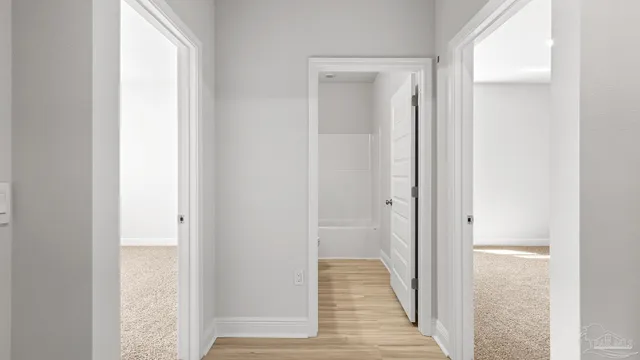 a view of a bathroom from the hallway