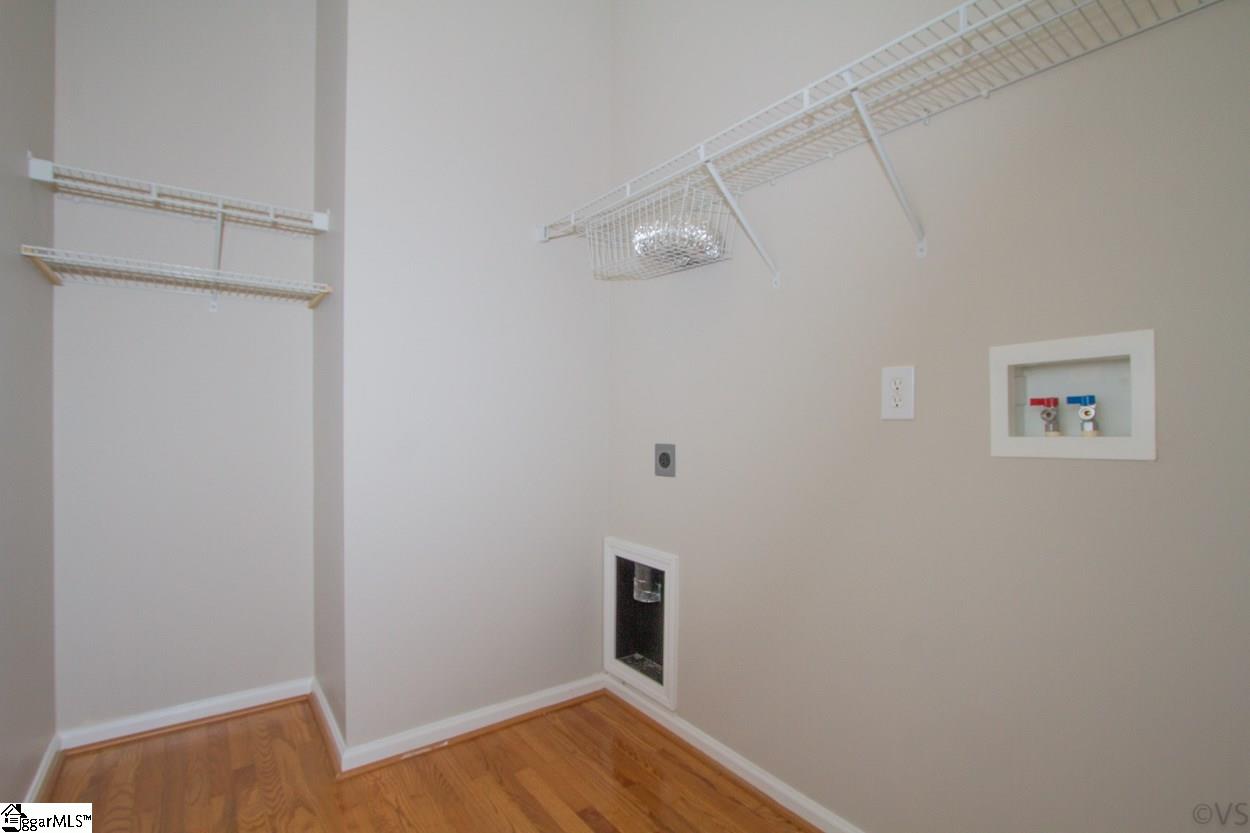 105 Selden Way Fountain Inn, SC 29644 - Photo 13 of 31 Laundry room with shelves and even a space to add a table for folding clothes.