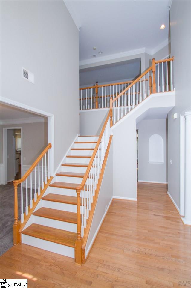 105 Selden Way Fountain Inn, SC 29644 - Photo 3 of 31 One of two sets of stairs leading up to the bedrooms. Beautiful hardwood floors and bright new paint.
