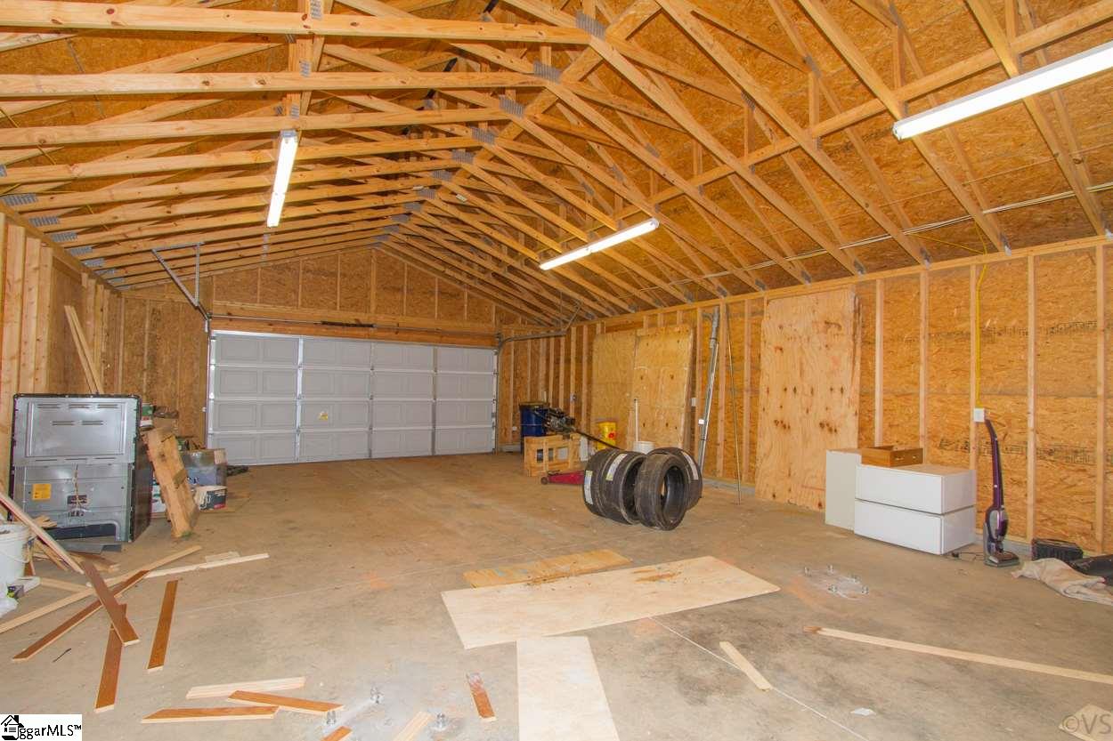 105 Selden Way Fountain Inn, SC 29644 - Photo 29 of 31 Large 39 x 24 workshop with power and window air unit, with roll up garage door, lots of space for your man-cave, workshop, etc.