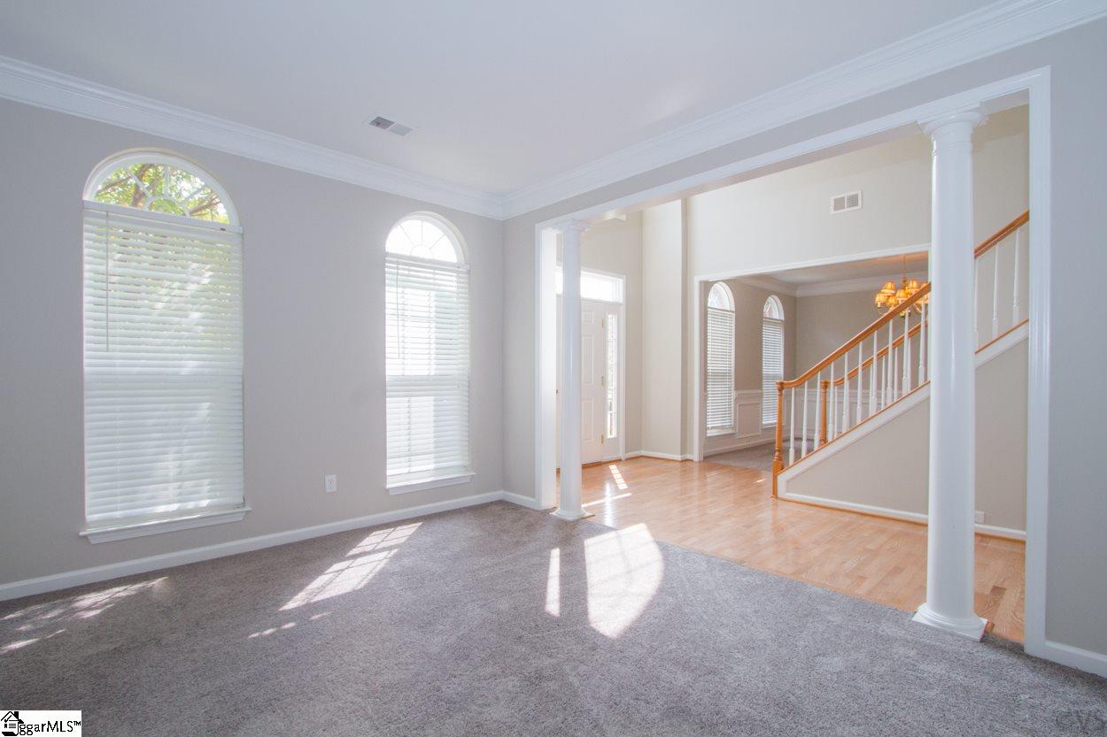 105 Selden Way Fountain Inn, SC 29644 - Photo 5 of 31 Formal living room with two columns, new carpet and paint, and crown molding.