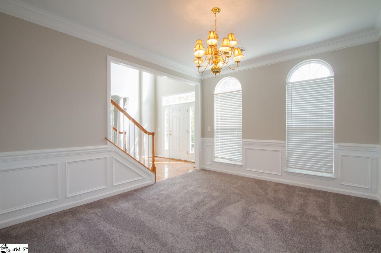 105 Selden Way Fountain Inn, SC 29644 - Photo 6 of 31 Formal dining room with so much natural light, new carpet and paint. Lovely crown moldings, picture-frame molding and chair rail.
