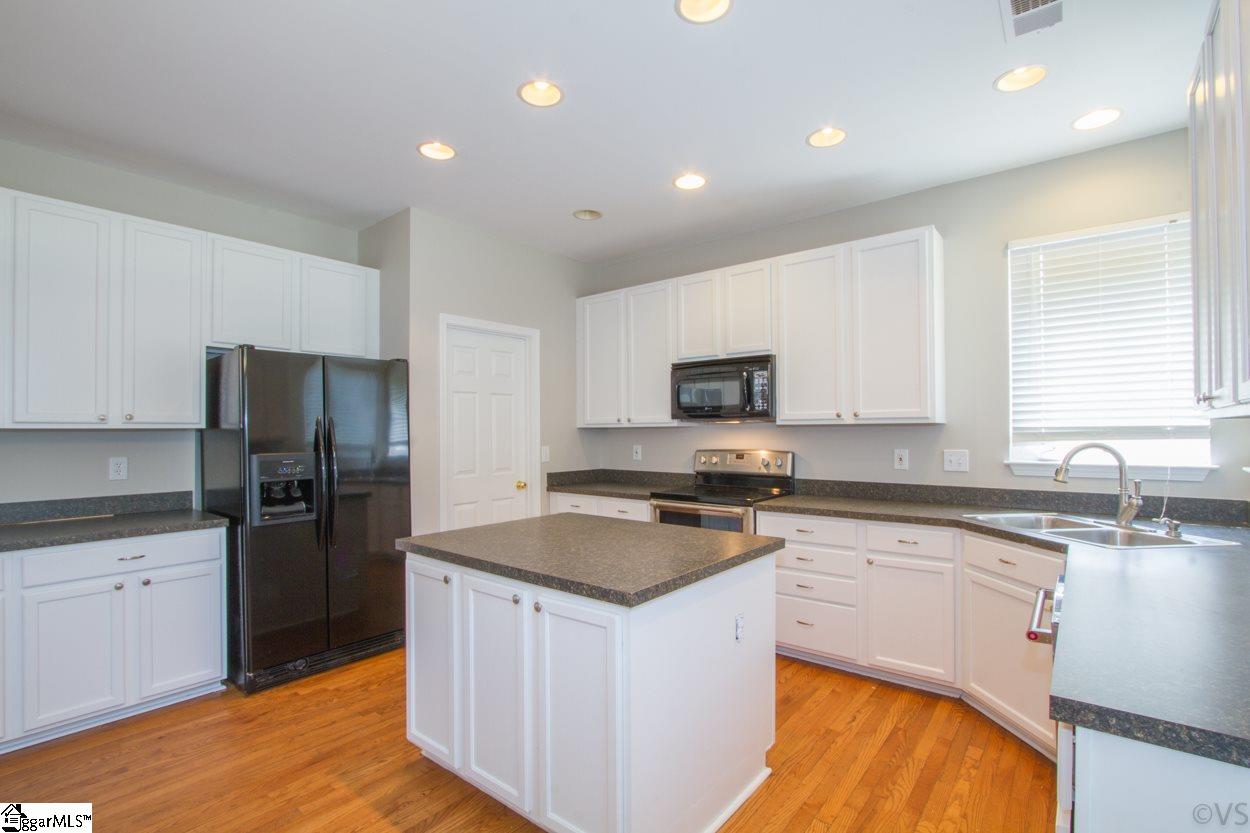 105 Selden Way Fountain Inn, SC 29644 - Photo 9 of 31 This kitchen will give you the space to have the whole family helping out! Love the island with extra storage and newly painted cabinets that just brighten up this large kitchen.