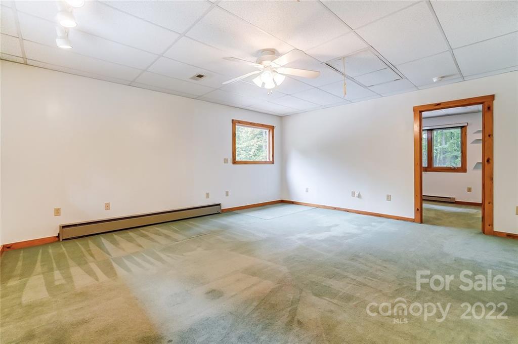 5618 Davis Road Waxhaw, NC 28173 - Photo 14 of 41 an empty room with windows and ceiling fan