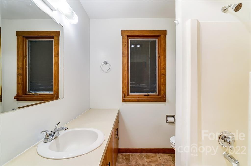 5618 Davis Road Waxhaw, NC 28173 - Photo 23 of 41 a bathroom with a sink and a mirror