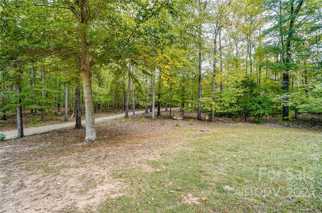 5618 Davis Road Waxhaw, NC 28173 - Photo 26 of 41 a view of outdoor space with deck and tree