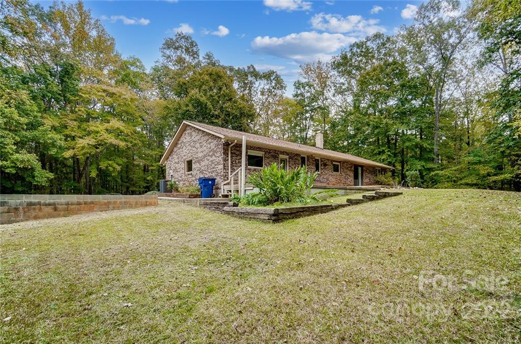 5618 Davis Road Waxhaw, NC 28173 - Photo 35 of 41 a view of a house with backyard and garden
