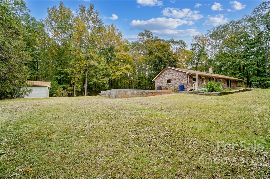 5618 Davis Road Waxhaw, NC 28173 - Photo 36 of 41 a view of a house with a yard