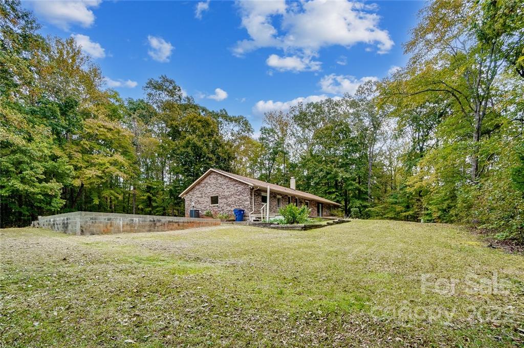 5618 Davis Road Waxhaw, NC 28173 - Photo 37 of 41 a view of a house with a yard
