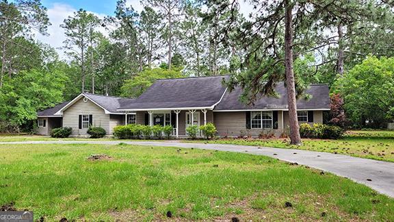 392 Poor Robin Extension Baxley, GA 31513 - Photo 1 of 1 a front view of a house with a yard