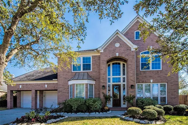 a front view of a house with swimming pool