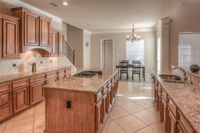 a kitchen with stainless steel appliances granite countertop a sink and cabinets