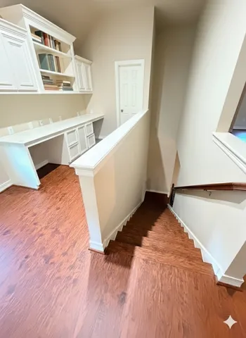 a front view of a house with a garden and yard