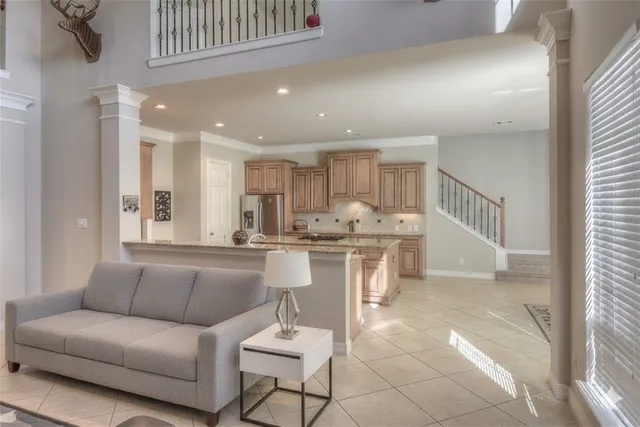 a living room with kitchen island furniture and a table