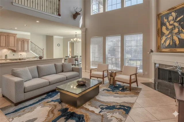 a living room with furniture wooden floor and a fireplace