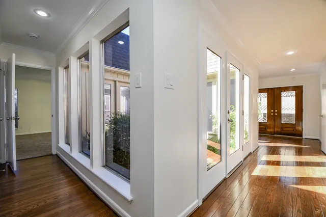 a view of a hallway view with wooden floor and staircase