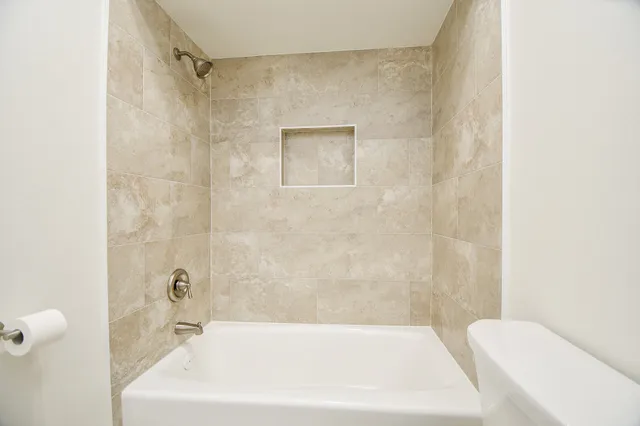a bathroom with a white bath tub