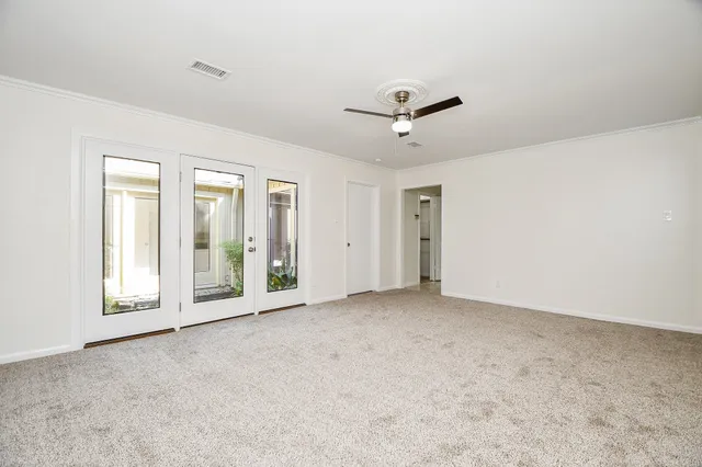 a view of an empty room with a window