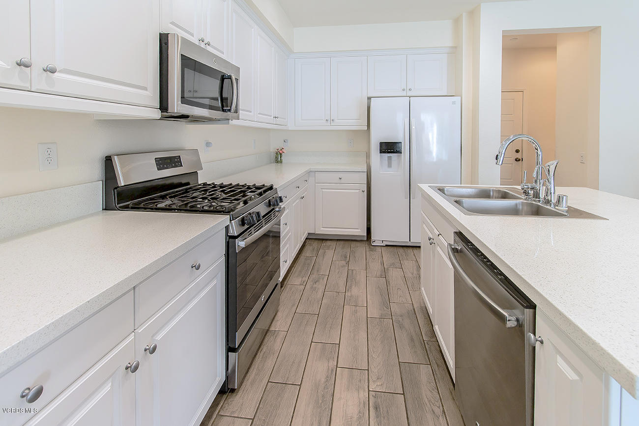2464 Blossom Ridge Court, Unit 2 Simi Valley, CA 93063 - Photo 13 of 41 a kitchen with a sink stove and refrigerator