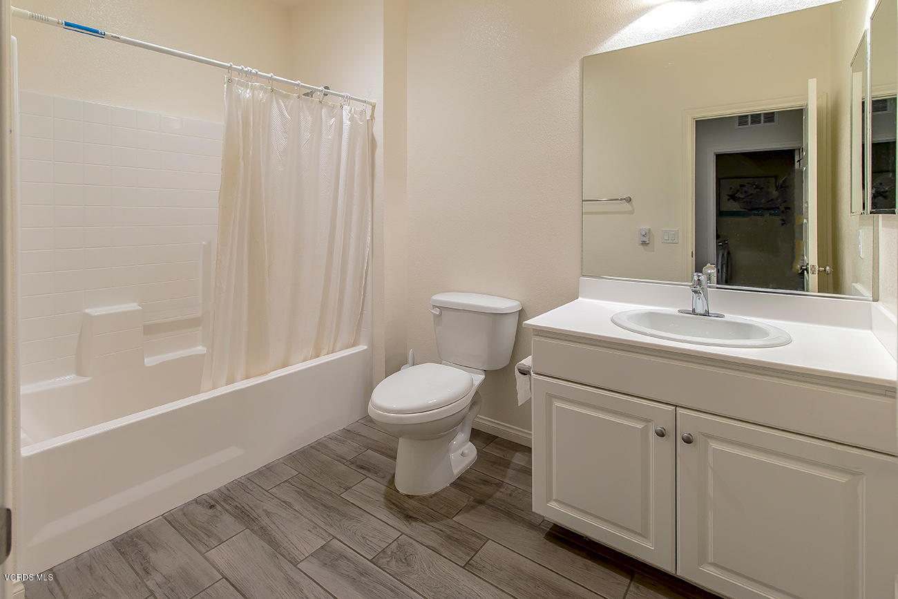2464 Blossom Ridge Court, Unit 2 Simi Valley, CA 93063 - Photo 16 of 41 a bathroom with a sink toilet and shower