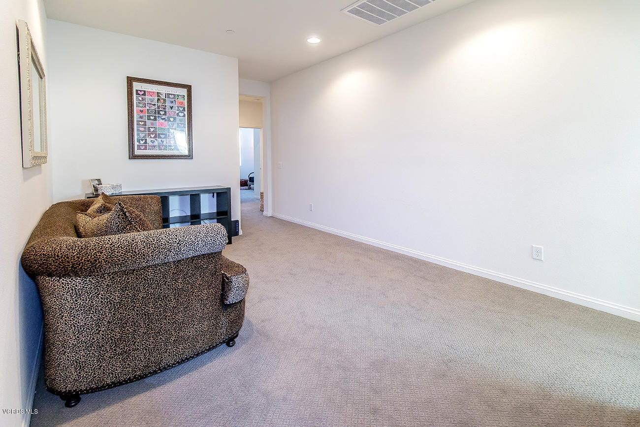2464 Blossom Ridge Court, Unit 2 Simi Valley, CA 93063 - Photo 18 of 41 a living room with furniture and a couch
