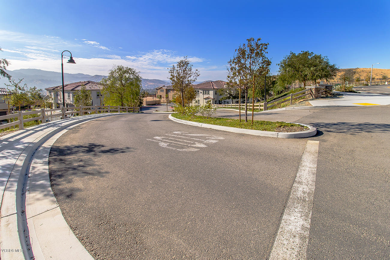 2464 Blossom Ridge Court, Unit 2 Simi Valley, CA 93063 - Photo 23 of 41 a view of a house with a yard