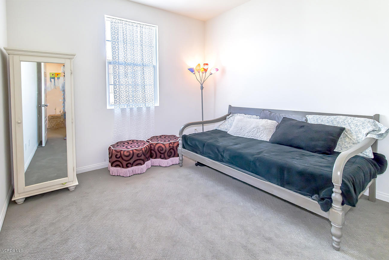 2464 Blossom Ridge Court, Unit 2 Simi Valley, CA 93063 - Photo 26 of 41 a living room with a couch