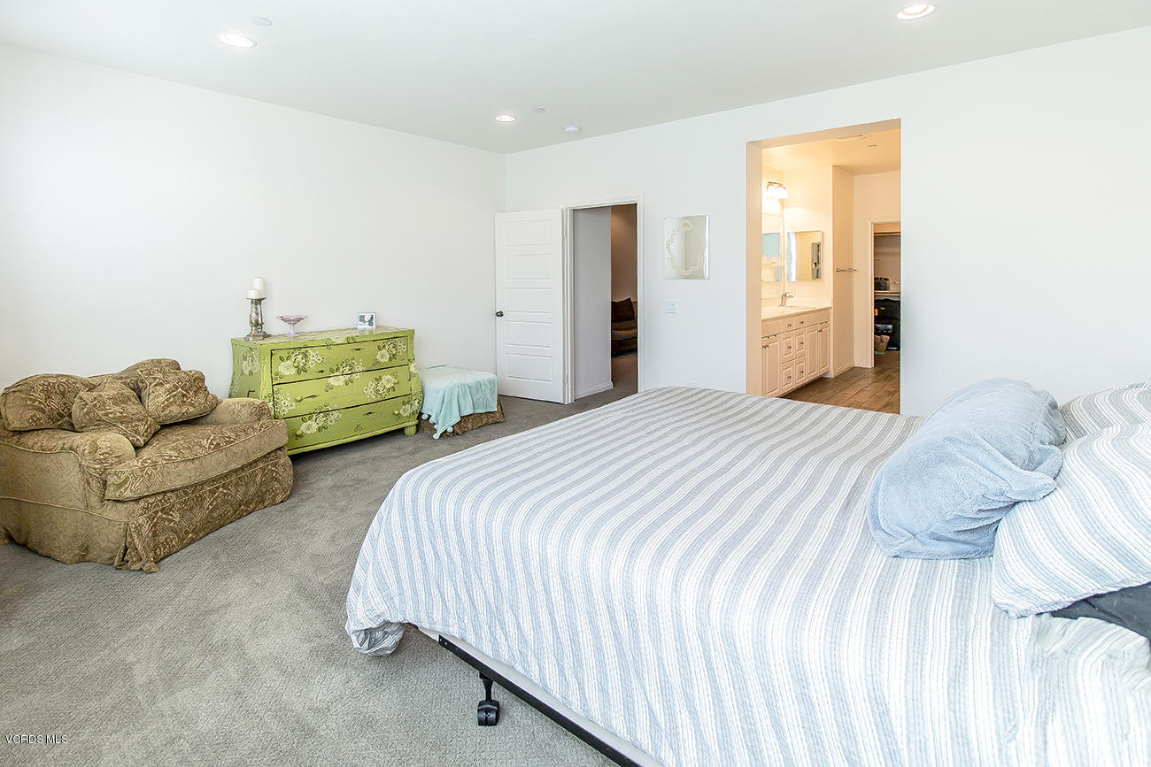 2464 Blossom Ridge Court, Unit 2 Simi Valley, CA 93063 - Photo 28 of 41 a bedroom with two beds and a couch