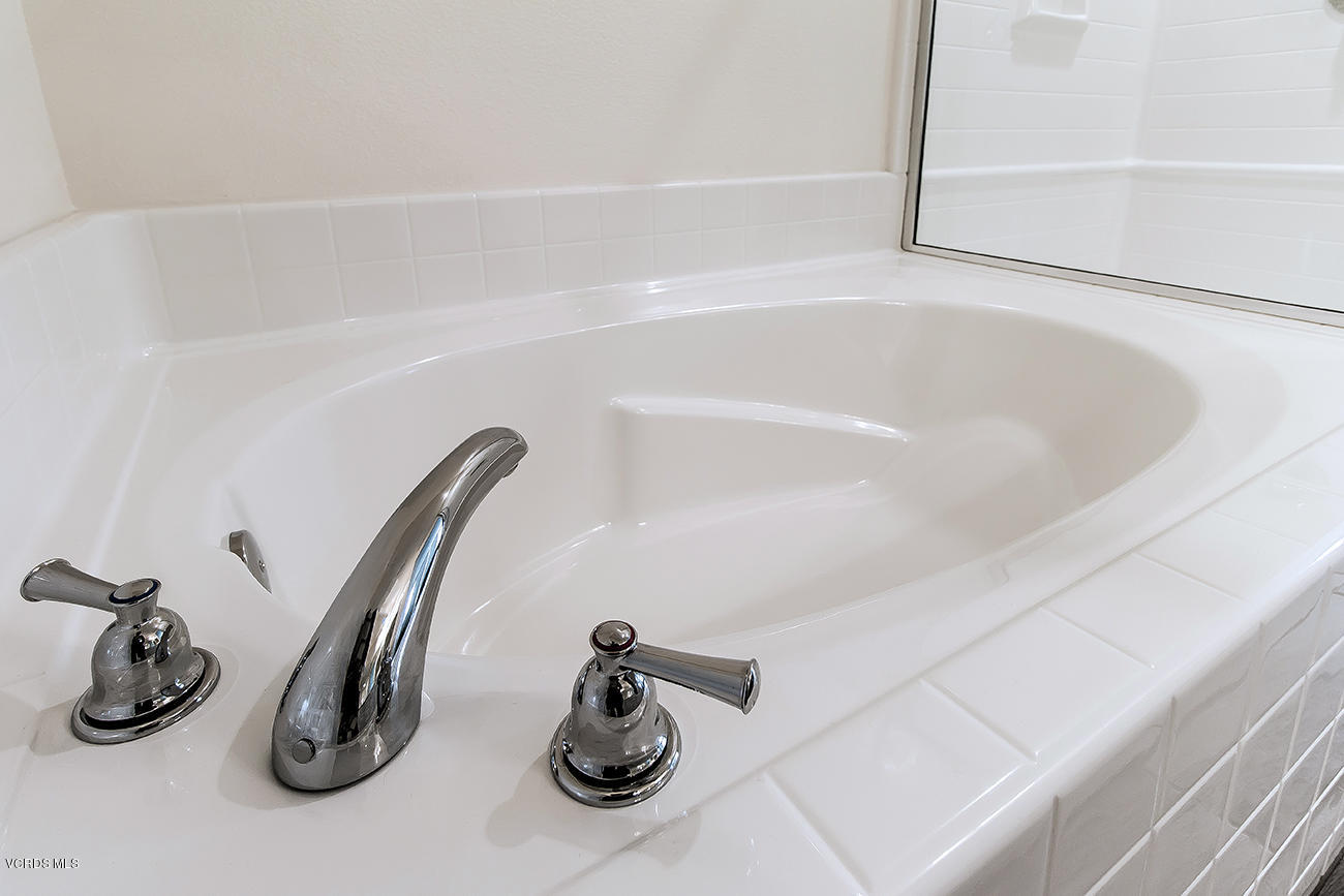 2464 Blossom Ridge Court, Unit 2 Simi Valley, CA 93063 - Photo 32 of 41 a bathroom with a sink and a vanity