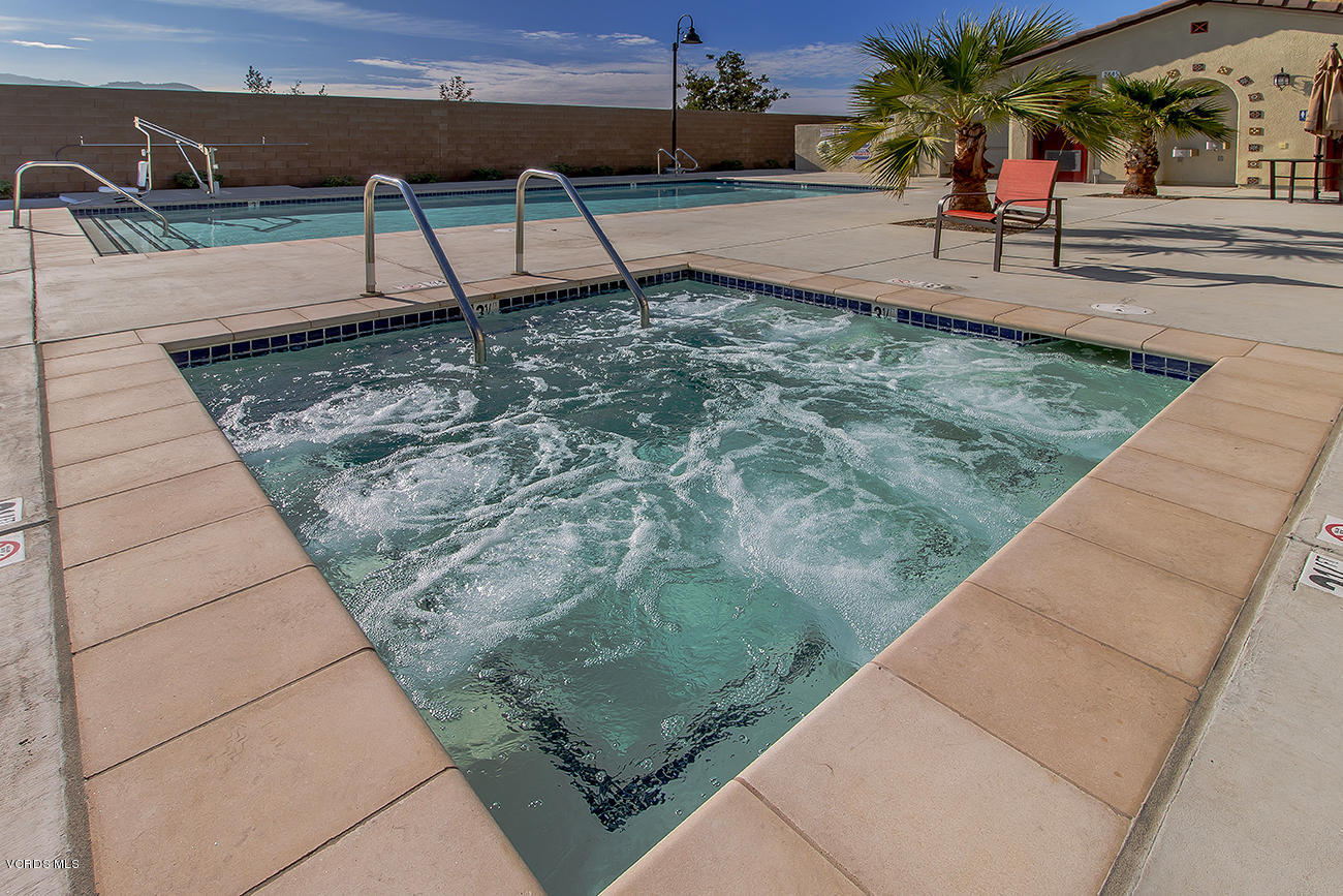 2464 Blossom Ridge Court, Unit 2 Simi Valley, CA 93063 - Photo 36 of 41 a view of a bench in the backyard