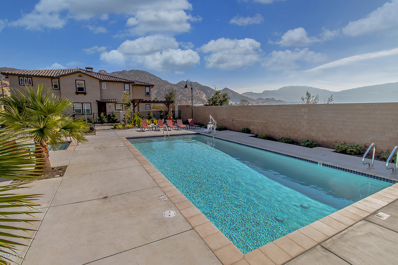 2464 Blossom Ridge Court, Unit 2 Simi Valley, CA 93063 - Photo 39 of 41 a city view with tall buildings and a yard