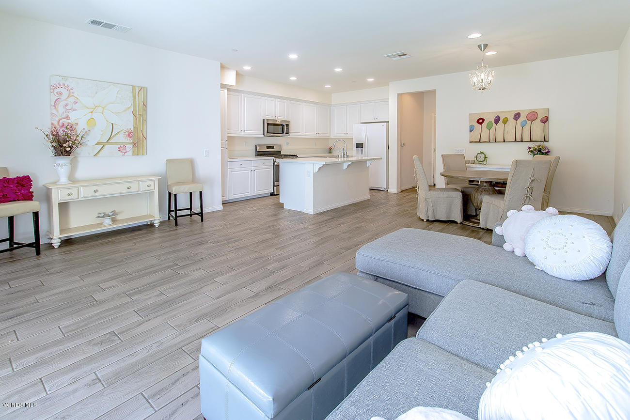 2464 Blossom Ridge Court, Unit 2 Simi Valley, CA 93063 - Photo 8 of 41 a living room with furniture and kitchen view with wooden floor