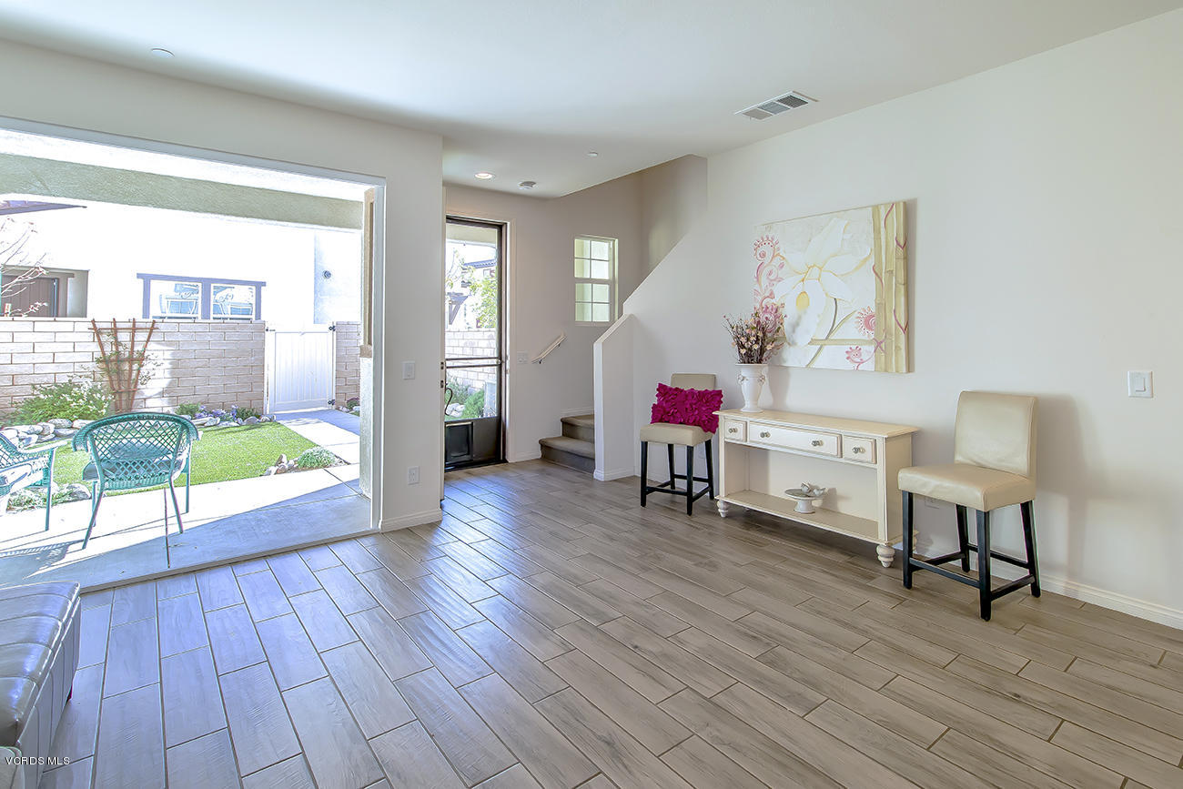 2464 Blossom Ridge Court, Unit 2 Simi Valley, CA 93063 - Photo 9 of 41 a living room with furniture and a wooden floor