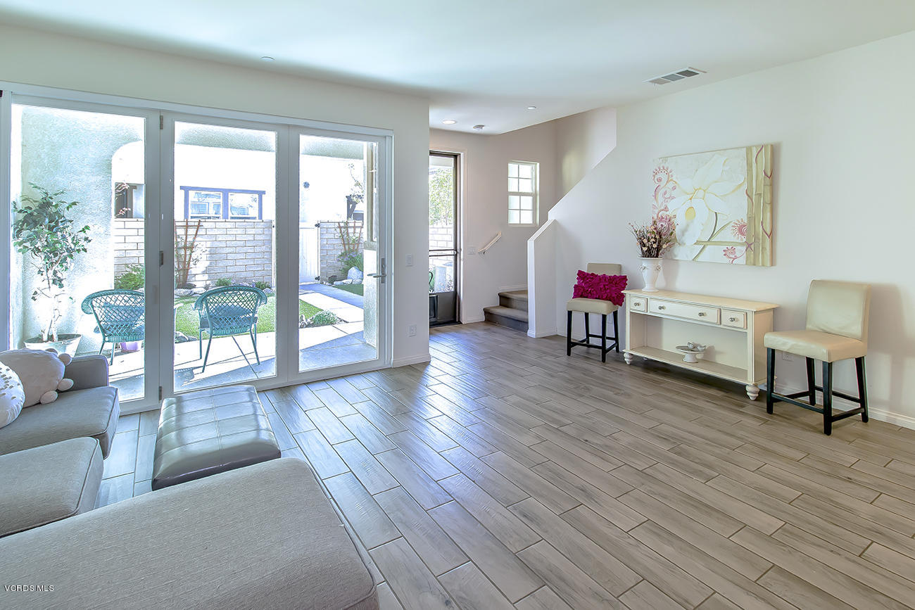 2464 Blossom Ridge Court, Unit 2 Simi Valley, CA 93063 - Photo 10 of 41 a living room with furniture and a wooden floor