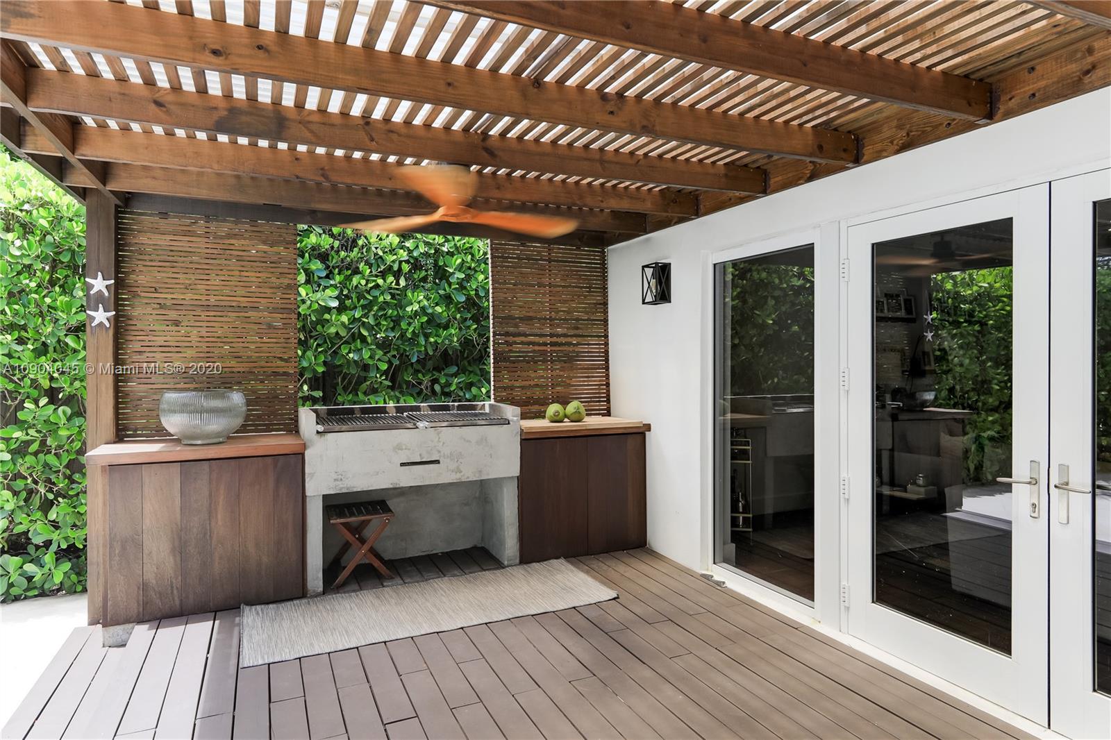 434 Southwest 30th Road Miami, FL 33129 - Photo 12 of 51 a view of a patio with table and chairs and potted plants